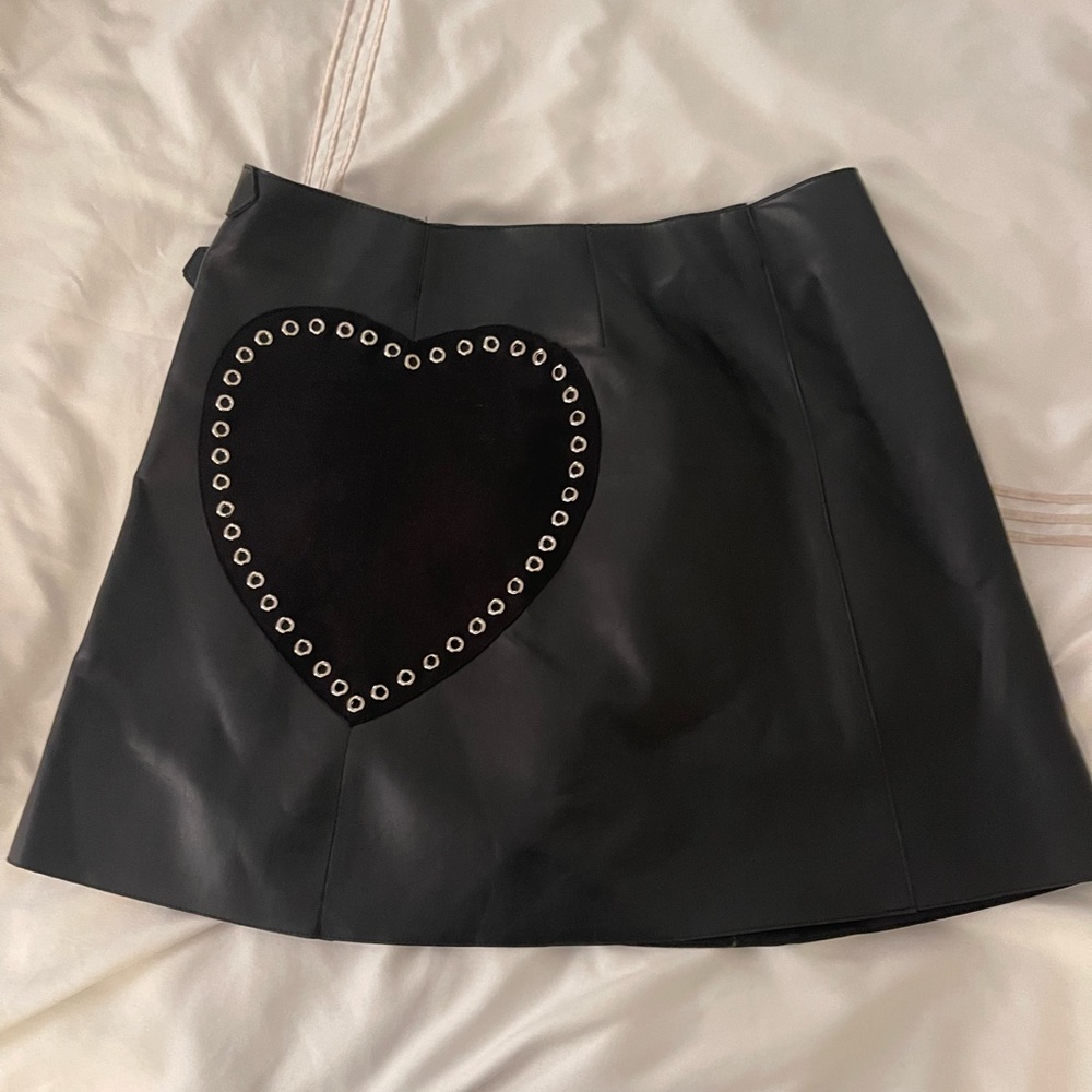 Leather skirt with silver buckle and suede patch heart